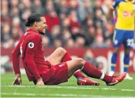  ?? Reuters ?? Liverpool’s Virgil van Dijk goes down after sustaining an injury during the match against Southampto­n on Saturday. —