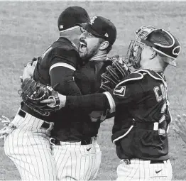  ?? David Banks / Associated Press ?? White Sox starting pitcher Carlos Rodon, center, celebrates his no-hitter against Cleveland with his teammates on Wednesday night at Chicago.