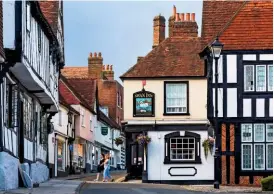  ??  ?? Midhurst’s timbered buildings survive on some of its most frequented streets, housing pubs and shops.