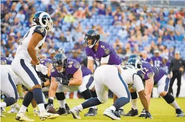  ?? ULYSSES MUÑOZ/BALTIMORE SUN ?? Quarterbac­k Joe Flacco, taking a snap in a preseason game against the Rams on Aug. 9, will be making his 11th seasonopen­ing start for the team in his 11th season when the Ravens host the Bills at M&amp;T Bank Stadium on Sunday.