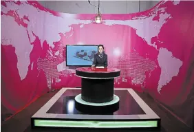  ?? RAHMAT GUL THE ASSOCIATED PRESS FILE PHOTO ?? Presenter Basira Joya records a news broadcast in 2017. Afghanista­n’s TOLOnews channel said Thursday it received a “final and nonnegotia­ble” order from the Taliban calling for female presenters to cover their faces.