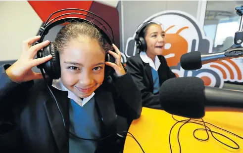  ?? Picture: Esa Alexander ?? Naseerah and Yusrah du Toit get ready to go on the air at the RX Radio station at the Red Cross War Memorial Children’s Hospital in Cape Town.