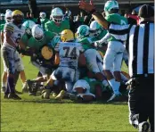  ?? PHOTO BY BRIAN SUMPTER ?? Middletown comes up short on a fourth-down run in the fourth quarter during a season-ending 35-7 playoff loss to St. Bernard’s.