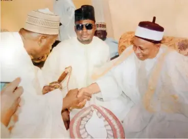  ?? Photo: Dangote ?? Alh. Ibrahim Ali Garga, Senior GM Dangote Group (left), congratula­tes the newly turbaned Zaifadan Biu Alhaji Mohammed Zaifada Kaidal, after the turbanning ceremony by the Emir of Biu in Borno State, Alh Mai Umar Mustapha at the weekend