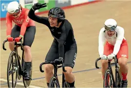  ?? AP ?? Ellesse Andrews waves to the crowd after winning the keirin, her third gold medal at the Games.