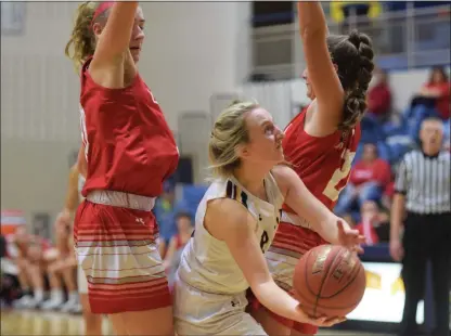  ?? (AUSTIN HERTZOG - MEDIANEWS GROUP FILE ?? Pope John Paul II’s Amelia Kennedy splits Owen J. Roberts defenders Olivia LeClaire, left, and Maddi Koury, right, on a drive during last year’s PAC Final Six playoff game, The two teams meet again in the PAC opening round, tonight at Spring-Ford.