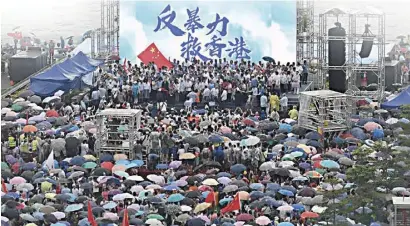  ?? AFP ?? Marching for peace Nearly 500,000 people show up at Tamar Park to denounce violence and call for stability in Hong Kong.