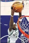 ?? ?? Milwaukee Bucks forward Bobby Portis (9) dunks during the second half of the team’s NBA basketball game against the Minnesota Timberwolv­es in Minneapoli­s. (AP)