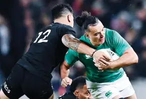 ?? ?? Aiming high: New Zealand high tackle against Ireland