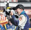  ?? Derik Hamilton ?? The Associated Press AJ Allmending­er after winning at Watkins Glen Internatio­nal in 2014 — his first NASCAR Cup series victory.