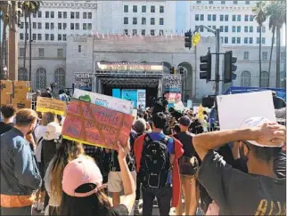  ?? Tony Barboza Los Angeles Times ?? CROWDS GATHER near Los Angeles City Hall in 2019 for a youth climate strike rally.