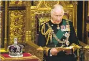  ?? ALASTAIR GRANT AP ?? Prince Charles reads the Queen’s Speech next to her crown during the State Opening of Parliament.