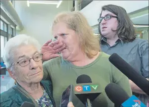  ?? CP PHOTO ?? Taylor Samson’s mother Linda Boutilier is flanked by his grandmothe­r Liz Samson, left, and his brother Connor Samson as they talk with reporters after the murder trial of William Sandeson at Nova Scotia Supreme Court in Halifax on Sunday. Sandeson was...