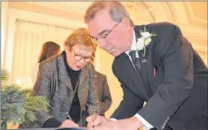  ?? DAVE STEWART/THE GUARDIAN ?? Philip Brown is officially sworn in as mayor of Charlottet­own by P.E.I. Court of Appeal Justice Michele Murphy during a ceremony on Thursday.