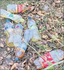  ??  ?? Bottles of urine at the roadside