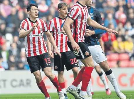  ?? ?? Sunderland played Luton in their traditiona­l black shorts. But the shorts will be red for the home game against Hull City on Good Friday.