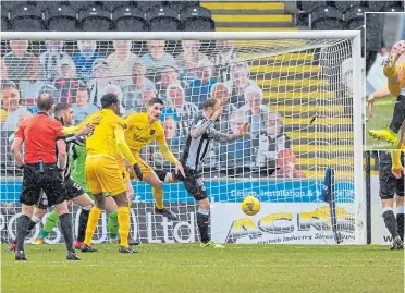  ??  ?? St Mirren’s Conor Mccarthy puts through his own net to give Livingston an early lead