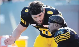  ?? PETER POWER THE CANADIAN PRESS ?? Hamilton Tiger-Cats quarterbac­k Jeremiah Masoli weathered season-ending injuries to several capable receivers, including Brandon Banks, right, to earn East Division all-star recognitio­n.