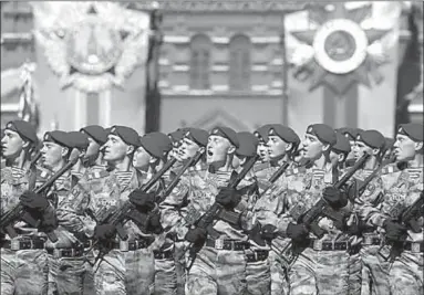  ??  ?? Russian servicemen march during the Victory Day parade at Red Square in Moscow. (Photo: Reuters)