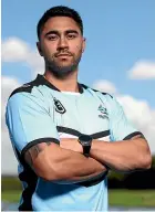  ??  ?? Shaun Johnson poses in his new colours, after signing with the Cronulla Sharks.