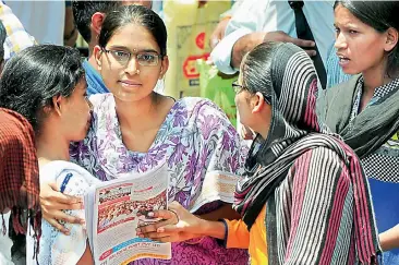  ?? —DC ?? Students greet each other after writing Neet at the Filmnagar centre on Sunday. Nearly 48,000 students appeared for the test in the state.