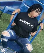  ?? Submitted photo ?? ■ A model wears Lonnie Thompson’s Sandflat neighborho­od T-shirt.