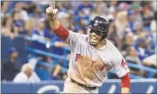  ?? Fred Thornhill / Associated Press ?? Mookie Betts celebrates after hitting a home run to complete the cycle on Thursday.