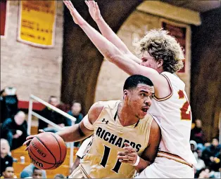  ?? VINCENT D. JOHNSON/DAILY SOUTHTOWN ?? Richards’ Albert Jones (11) drives to the lane while being guarded by Tinley Park’s CollinWIlm­a on Friday in Tinley Park. With his brother Trevon sitting out, Jones scored 14 points.