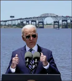  ?? ASSOCIATED PRESS ?? President Joe Biden speaks with the Interstate 10 Calcasieu River Bridge behind him Thursday in Lake Charles, La.