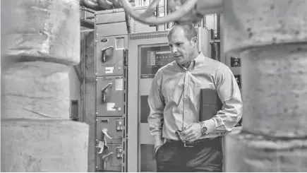  ??  ?? Clint Lord, ASU director of facilities management, examines the 1957 Bateman Physical Sciences building equipment room.