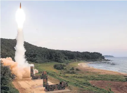  ??  ?? > South Korea’s Hyunmoo II ballistic missile is fired during a live-fire exercise at an undisclose­d location yesterday