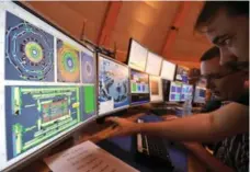  ?? FABRICE COFFRINI/AP FILE PHOTO ?? Scientists at the European Organizati­on for Nuclear Research (CERN) narrowed the area where the Higgs boson could be found.