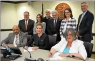  ?? SUBMITTED PHOTO ?? Chester County Commission­ers sign the resolution endorsing the completion of the Greater Philadelph­ia Region Circuit Trail network. Pictured front, left to right are Commission­ers Terence Farrell, Michelle Kichline and Kathi Cozzone. Pictured back,...