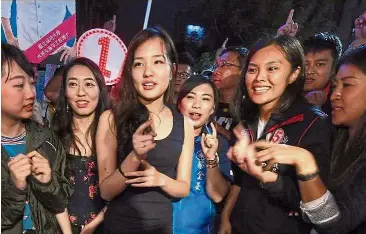  ?? — CNA ?? Going Coco: During the election campaign, the social media savvy millennial visited and shook hands with Kaohsiung residents from street to street, attending television shows and answering questions from reporters to win their votes for her father.