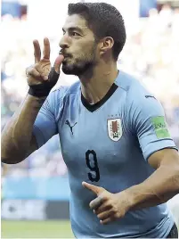  ??  ?? Uruguay’s Luis Suarez celebrates scoring his side’s opening goal against Saudi Arabia during their Group A FIFA World Cup match in Rostov Arena in Rostov-on-Don, Russia, yesterday.