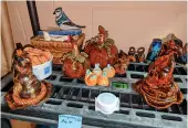  ?? ?? Sorting hats and Halloween pumpkins glazed in rich fall colours. Photo by Gordon Edgar