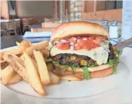  ?? SUBMITTED PHOTO ?? Topped with pepper jack cheese, pico salsa and ancho mayo, this black bean-corn veggie burger from Final Approach is loaded with flavor.