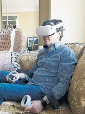  ?? PAIGE TAYLOR WHITE TORONTO STAR ?? “What’s exciting right now for investors is the potential to own a piece of our virtual future,” said Lorne Sugarman, seen at his Toronto home sporting his VR headset. Sugarman’s digital real estate company, the Metaverse Group, bought 165 digital parcels of land on which it is building virtual corporate offices, a marina — even a yacht.