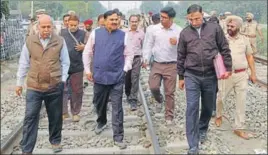  ??  ?? Commission­er of Railway Safety SK Pathak (C) with other officials at the accident site in Amritsar on Sunday. SAMEER SEHGAL/HT