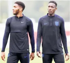  ??  ?? England’s defender Joe Gomez (left) and Danny Welbeck takes part in an open training session at St George’s Park in Burton-on-Trent, central England. — Reuters photo