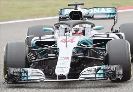  ??  ?? Mercedes’ driver Lewis Hamilton takes a corner during a practice session ahead of the Chinese Grand Prix in Shanghai on Friday. — AFP