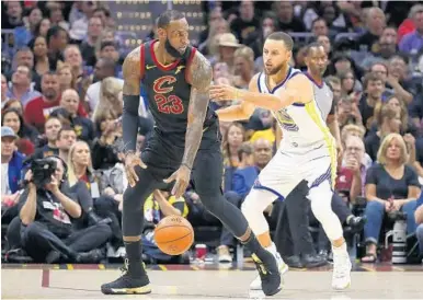  ?? GREGORY SHAMUS/GETTY IMAGES ?? With the Los Angeles Lakers, LeBron James will be going up against Stephen Curry, right, and the Golden State Warriors more often in the regular season and in the Western Conference playoffs rather in the finals like he did the last four years.