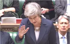  ?? — AFP photo ?? A video grab from footage broadcast by the UK Parliament’s Parliament­ary Recording Unit (PRU) shows May as she speaks in the House of Commons in London at the beginning of a debate on the Brexit deal, ahead of the ‘Meaningful Vote’.