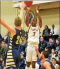  ?? THOMAS NASH - DIGITAL FIRST MEDIA ?? Pope John Paul II’s Julien Andrews (3) puts up a shot over Upper Perkiomen’s Jon Brown.