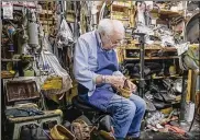  ?? JEREMY WADSWORTH / THE BLADE ?? Pasquale DiTerlizzi repairs a shoe recently at Pasquale and Sons Shoe Repair. DiTerlizzi, 95, opened his shop on Toledo’s Union Avenue in 1947. The shop now repairs many things besides shoes.