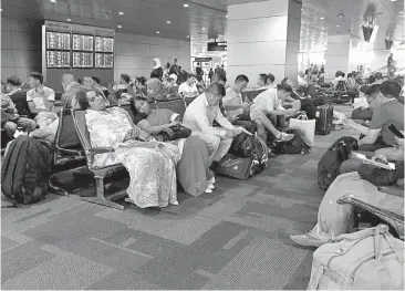  ??  ?? Passengers whose flights were cancelled wait in Hamad Internatio­nal Airport in Doha, Qatar, after neighbouri­ng countries banned Qatar’s planes from flying through their airspace. Harry Sterling writes that states such as Saudi Arabia took comments by...