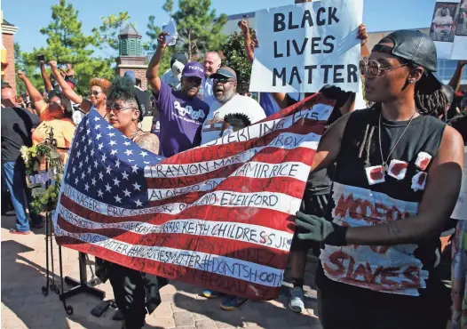  ?? SUE OGROCKI/AP FILE ?? A Black Lives Matter rally is held in Oklahoma City in 2016. Oklahoma City continues to register wide public approval of the police even though the state has the highest mortality rate from police violence in the country.