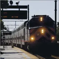  ??  ?? A southbound Caltrain train arrives at the Santa Clara Caltrain Station in Santa Clara on Tuesday.