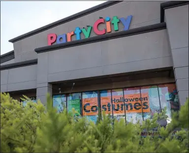  ?? (Bloomberg News WPNS/David Paul Morris) ?? A “Halloween Costumes” sign is displayed in the window of a Party City store in Richmond, Calif., in September 2020.