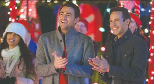  ?? HALLMARK ?? Jonathan Bennett, left, and Brad Harder star as a gay couple in The Christmas House — a movie in which their relationsh­ip is not central to the plot, but at least acknowledg­ed.
